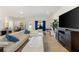 Open concept living area with sectional sofa and views to kitchen and entry at 6421 Alamanda Hills Dr, Lakeland, FL 33813
