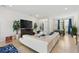 Open concept living room with sectional sofa, fireplace and large TV at 6421 Alamanda Hills Dr, Lakeland, FL 33813