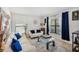 Living room with off-white sofas and blue velvet pillows at 6421 Alamanda Hills Dr, Lakeland, FL 33813