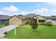 One-story home with two-car garage and well-manicured lawn at 6421 Alamanda Hills Dr, Lakeland, FL 33813