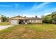 Brick ranch house with attached garage and spacious yard at 329 N 19Th St, Haines City, FL 33844