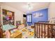 bedroom with a crib, dresser, and toy storage at 329 N 19Th St, Haines City, FL 33844