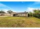 Brick ranch home with a single-car garage and mature trees at 329 N 19Th St, Haines City, FL 33844