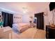 Main bedroom with a large bed, full-length mirror, and ample closet space at 329 N 19Th St, Haines City, FL 33844