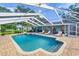 Inviting screened pool with patio and lounge chairs at 3245 Cross Fox Dr, Mulberry, FL 33860