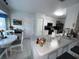 Kitchen with island and adjacent dining area at 657 Sweetwater Way, Haines City, FL 33844
