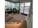 Sunroom with comfy seating and access to backyard at 657 Sweetwater Way, Haines City, FL 33844