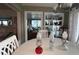 Dining room with view into living room and sunroom at 657 Sweetwater Way, Haines City, FL 33844