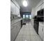 Open kitchen with stainless steel appliances and breakfast nook at 657 Sweetwater Way, Haines City, FL 33844