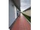 Sidewalk leads to backyard with grassy areas at 657 Sweetwater Way, Haines City, FL 33844