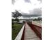 Wooden dock extending over calm lake water at 657 Sweetwater Way, Haines City, FL 33844