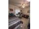 Guest bedroom with twin beds and window coverings at 657 Sweetwater Way, Haines City, FL 33844