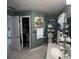 Bathroom with walk-in closet, vanity, and toilet at 657 Sweetwater Way, Haines City, FL 33844