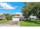 Charming single-story home with a two-car garage and mature landscaping at 4353 Dinner Lake Dr, Lake Wales, FL 33859