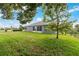 House backyard with green lawn at 4353 Dinner Lake Dr, Lake Wales, FL 33859