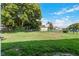 Large grassy backyard with chain link fence at 4353 Dinner Lake Dr, Lake Wales, FL 33859