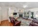 Spacious living room with hardwood floors and fireplace at 4353 Dinner Lake Dr, Lake Wales, FL 33859