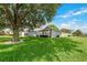 House with mature tree and well-manicured lawn at 4353 Dinner Lake Dr, Lake Wales, FL 33859