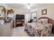 Spacious bedroom with a queen-size bed and TV at 4353 Dinner Lake Dr, Lake Wales, FL 33859