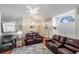 Spacious living room with leather furniture and hardwood floors at 4353 Dinner Lake Dr, Lake Wales, FL 33859