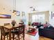 Bright living room with hardwood floors, comfy seating, and a dining area at 8105 Coconut Palm Way # 204, Kissimmee, FL 34747