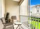 Screened-in patio with seating and a fire pit feature at 8105 Coconut Palm Way # 204, Kissimmee, FL 34747