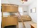 Bedroom with a bunk bed, sofa, and a window at 8105 Coconut Palm Way # 204, Kissimmee, FL 34747