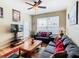 Living room features hardwood floors, sofa, and a coffee table at 8105 Coconut Palm Way # 204, Kissimmee, FL 34747