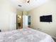 Spacious bedroom with a large bed and en-suite bathroom at 8105 Coconut Palm Way # 204, Kissimmee, FL 34747