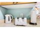 Kitchen counter with a toaster, kettle, and paper towels at 8105 Coconut Palm Way # 204, Kissimmee, FL 34747