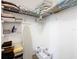 Well-organized closet with wire shelving and laundry basket at 8105 Coconut Palm Way # 204, Kissimmee, FL 34747