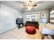 Cozy living room featuring a sofa, ottoman, and wall-mounted TV at 2920 Gause St, Bartow, FL 33830