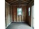 Simple shed interior with one window and wood framing at 2920 Gause St, Bartow, FL 33830