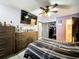 Bright bedroom with a large TV and dresser at 2920 Gause St, Bartow, FL 33830
