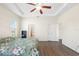 Large bedroom with wood floors and access to a private bathroom at 192 Viola Dr, Auburndale, FL 33823
