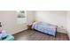 Small bedroom with twin bed and window at 192 Viola Dr, Auburndale, FL 33823