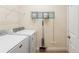 Laundry room with washer, dryer, and storage at 192 Viola Dr, Auburndale, FL 33823