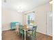 Dining room with hardwood floors and teal colored furniture at 192 Viola Dr, Auburndale, FL 33823