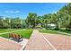 Pathway and park bench near a grassy area at 192 Viola Dr, Auburndale, FL 33823