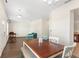 Dining area with hardwood floors and a view to the living room at 192 Viola Dr, Auburndale, FL 33823