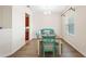Dining room features hardwood floors, a wooden table, and teal chairs at 192 Viola Dr, Auburndale, FL 33823