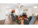Open living room with hardwood floors, kitchen views, and comfortable seating at 192 Viola Dr, Auburndale, FL 33823