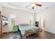 Spacious bedroom with wood floors, ceiling fan, and ample closet space at 192 Viola Dr, Auburndale, FL 33823
