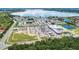 Aerial view of community near a lake and shopping center at 192 Viola Dr, Auburndale, FL 33823