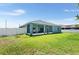 Spacious backyard with screened patio and fenced yard at 192 Viola Dr, Auburndale, FL 33823
