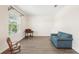Bright living room with hardwood floors, comfy seating, and large window at 192 Viola Dr, Auburndale, FL 33823