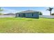 Large backyard with screened patio and white vinyl fence at 192 Viola Dr, Auburndale, FL 33823