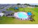 Resort-style community pool with a clubhouse and lounge chairs at 1234 Tagliamento Ln, Haines City, FL 33844