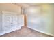 Bedroom with double door closet and access to bathroom at 1234 Tagliamento Ln, Haines City, FL 33844