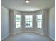 Bedroom featuring a bay window and neutral decor at 1269 Tagliamento Ln, Haines City, FL 33844